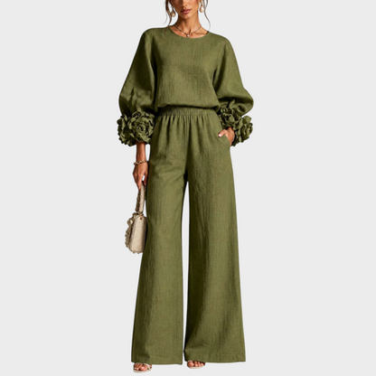 Model in the olive green set, front view, one hand in the trouser pocket 4