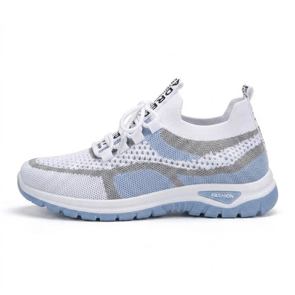 Side view of a white mesh lace-up trainer with pale blue panels, grey stripes and a matching pale blue chunky sole. 1