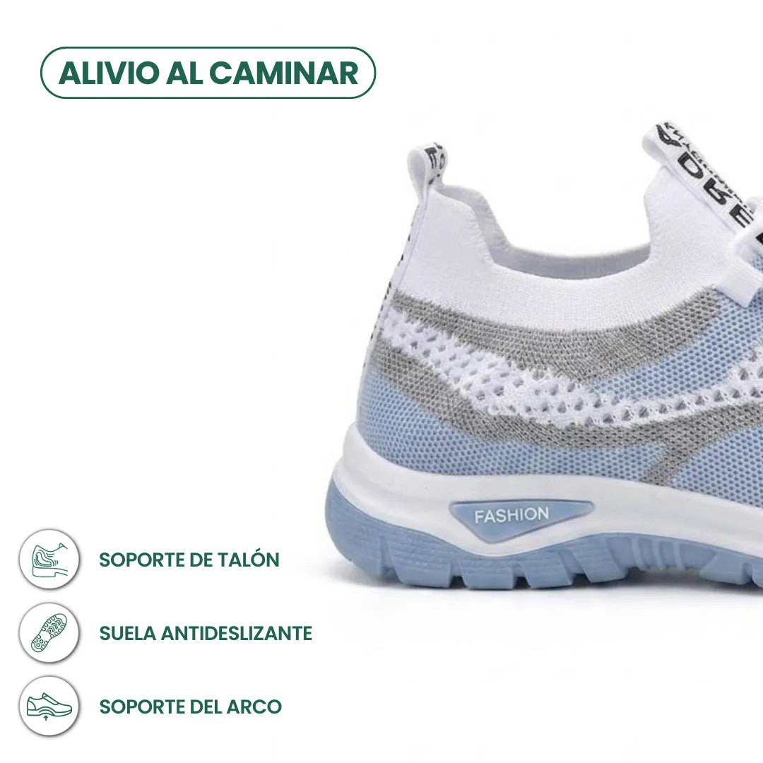 Rear three-quarter view of the pale blue trainer showing the heel and sole, with icons for heel support and anti-slip sole. 4