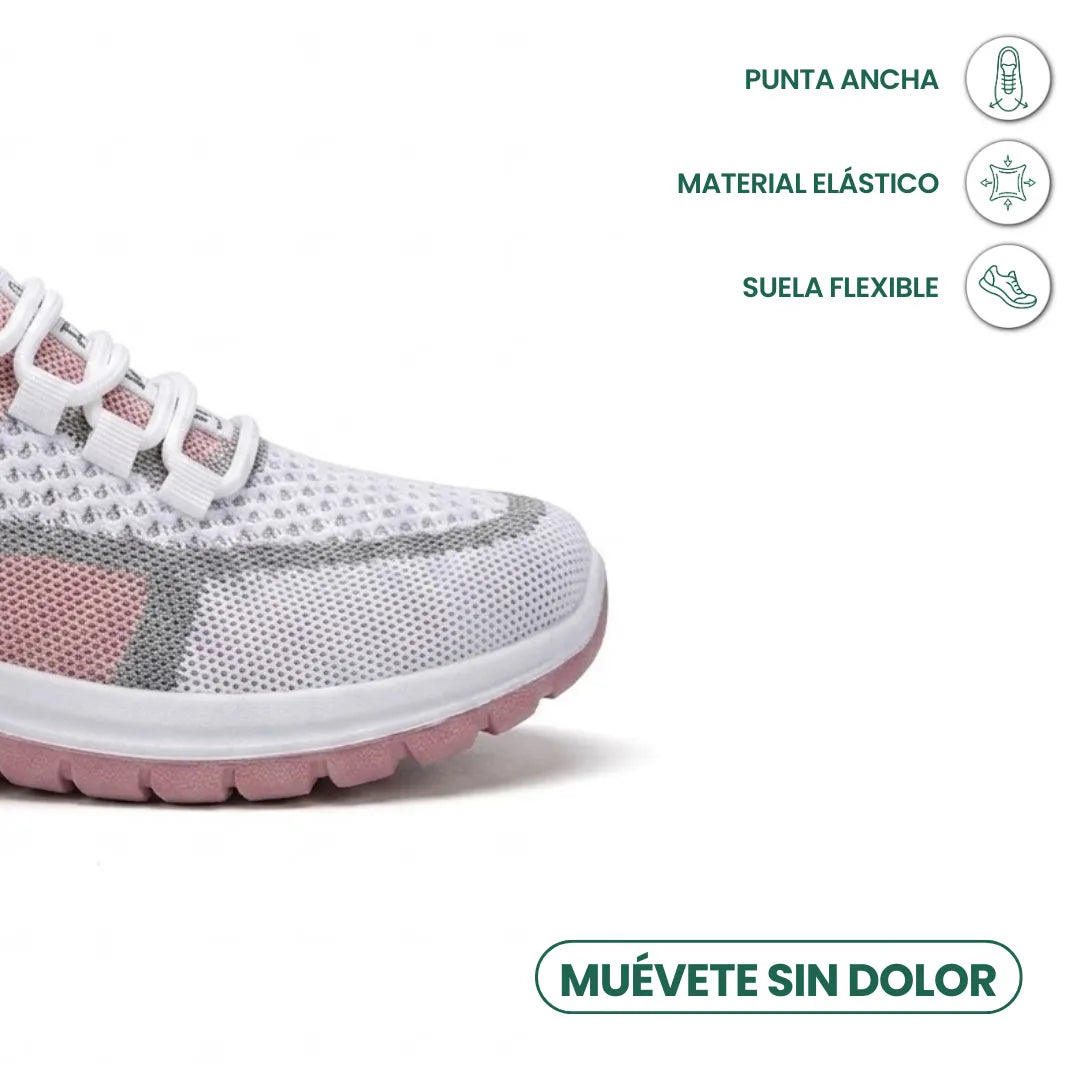 Close-up of the wide toe box of a white, grey and pink mesh trainer, with comfort feature icons. 23