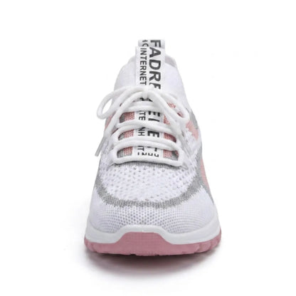 Front view of a white and pink mesh trainer showing the laces, wide toe area and pink sole. 26