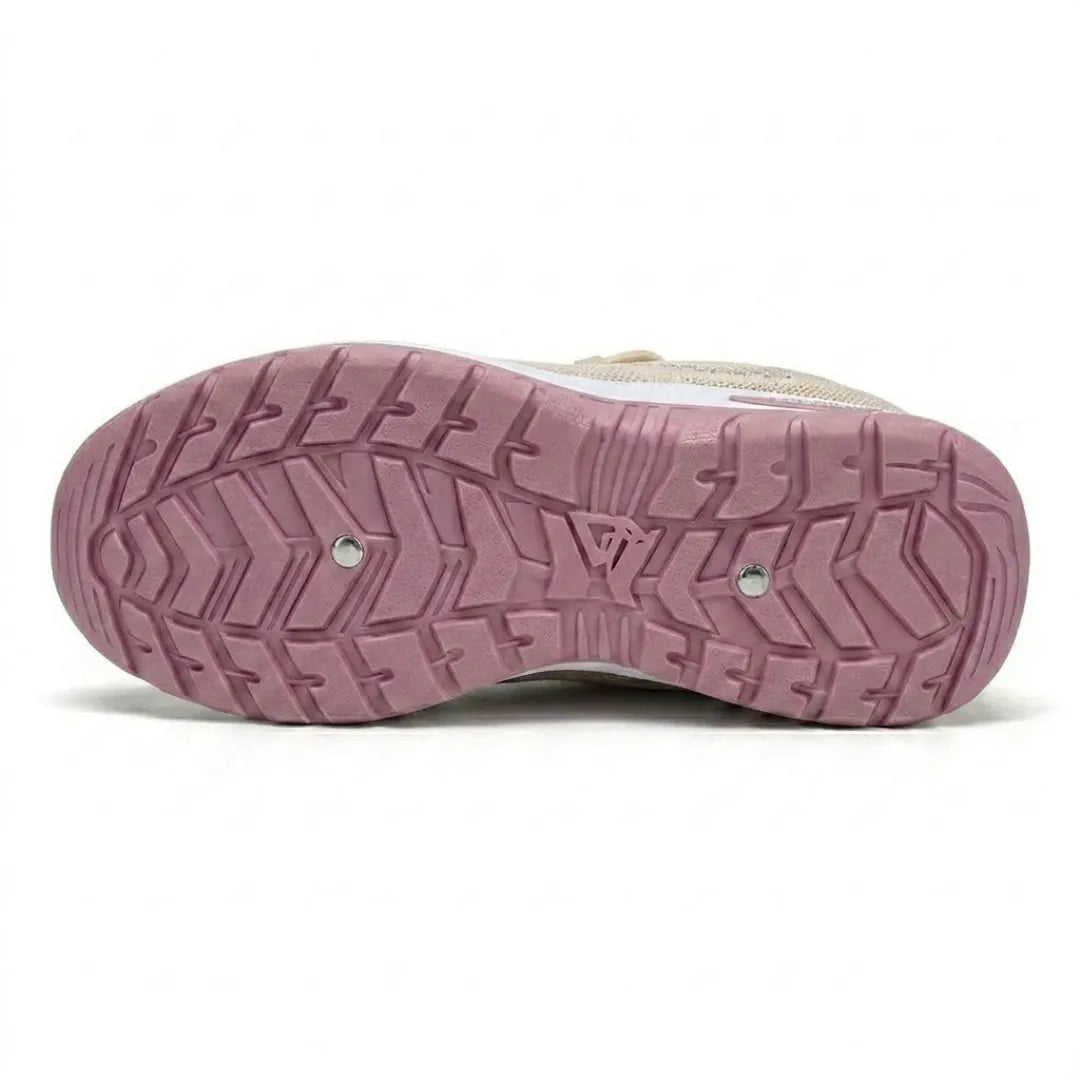 Underside of a beige trainer showing the pink tread pattern of the non-slip sole. 36