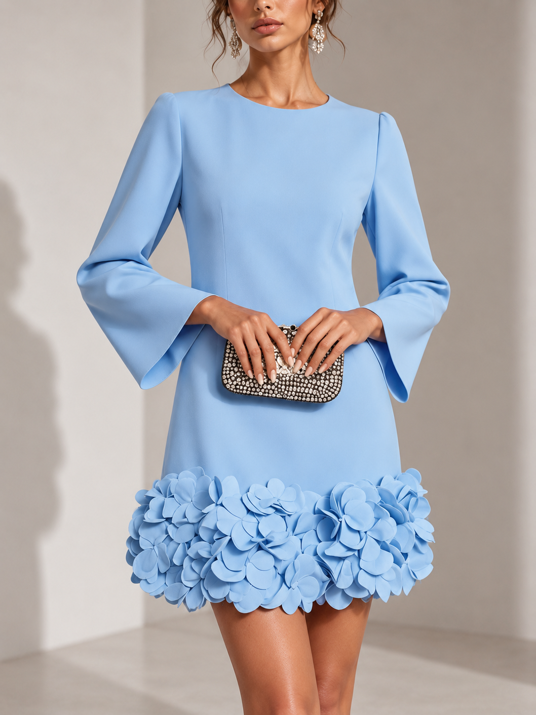 Light blue version of the dress, close front view, with flared sleeves and a hem of 3D petals. 5
