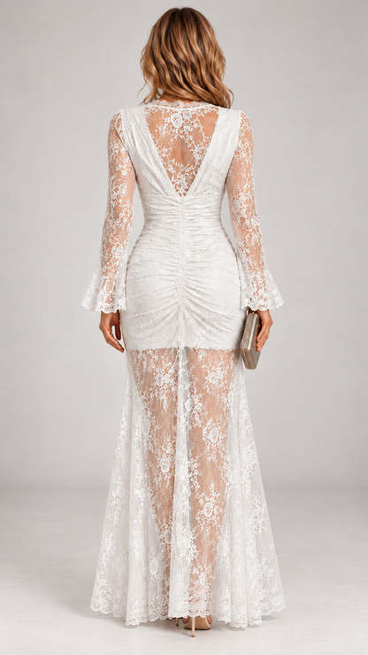 Back view of the white lace maxi dress, showing the open V-back, ruched centre seam and sheer lace skirt. 4