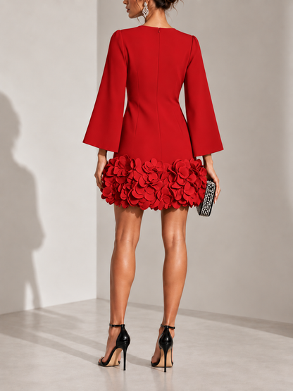 Back view of the red dress, showing the centre zip, back seams and the petal appliqué hem. 15