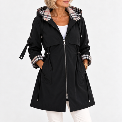 Front view of the black version on a model, zipped open, with check hood lining, turned-back cuffs and drawcord waist. 4