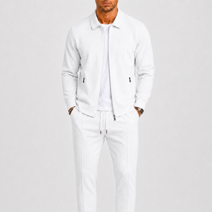 Model wears the same waffle-textured two piece set in white, with zip jacket and trousers 2