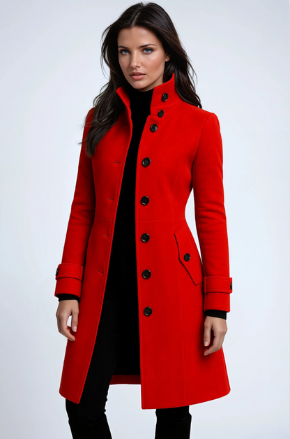 Model wearing the coat in bright red, buttoned front, flap pocket and strapped cuffs visible 3
