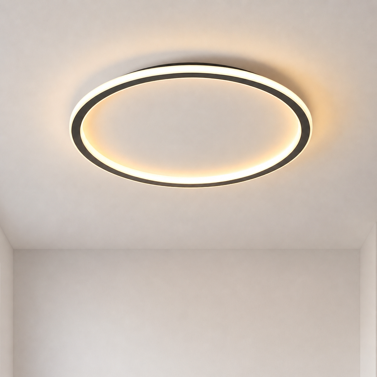 Slim black ring light lit with warm white glow, mounted flush on a plain pale ceiling, seen from below. 1