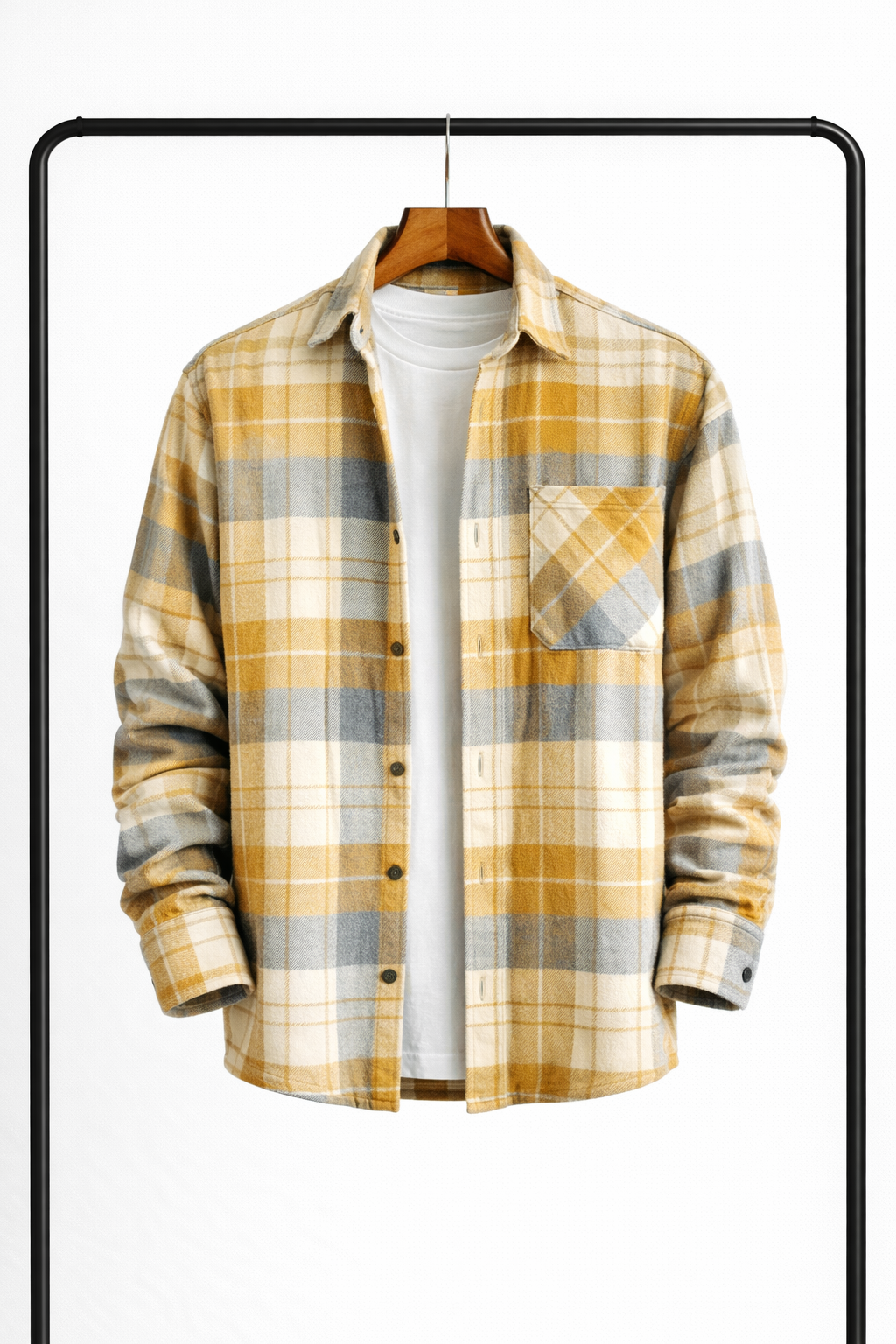 Front view of the overshirt in mustard yellow, grey and cream check, hanging open over a white tee. 4