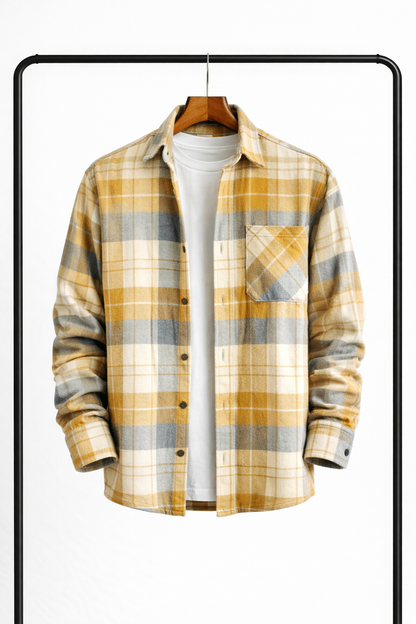 Front view of the overshirt in mustard yellow, grey and cream check, hanging open over a white tee. 4