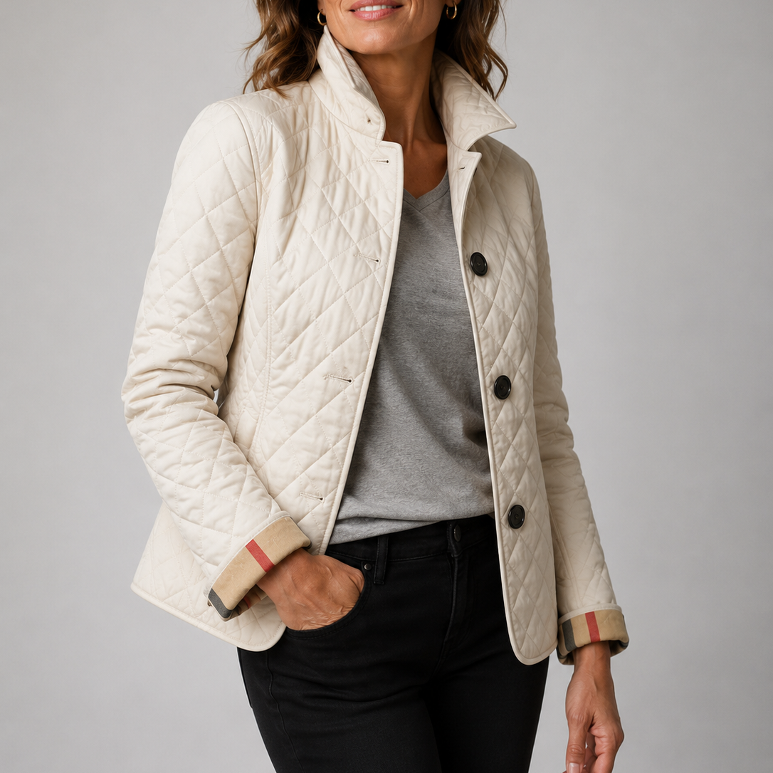 Cream quilted jacket with checked turned-back cuffs, worn over a grey top and black jeans 6