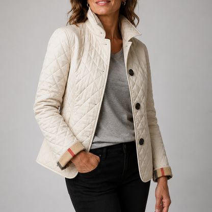 Cream quilted jacket with checked turned-back cuffs, worn over a grey top and black jeans 6
