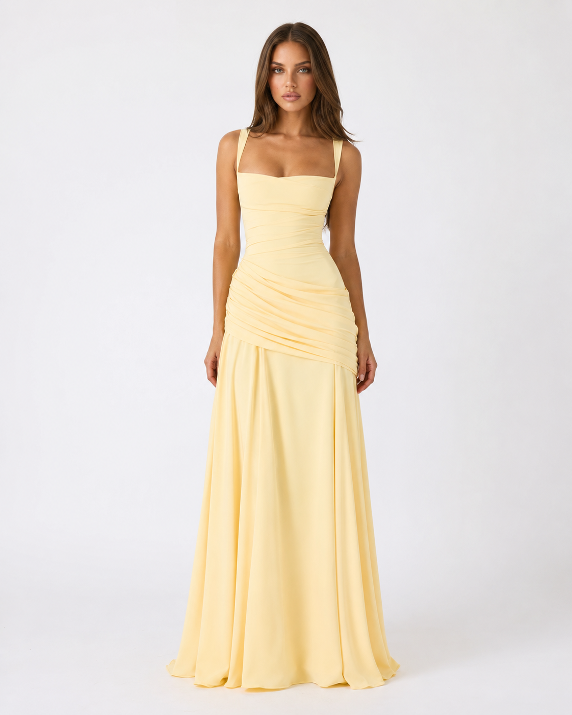 Model facing the camera in the pale yellow chiffon maxi dress, showing the square neckline, wide straps and draped hip panel. 1
