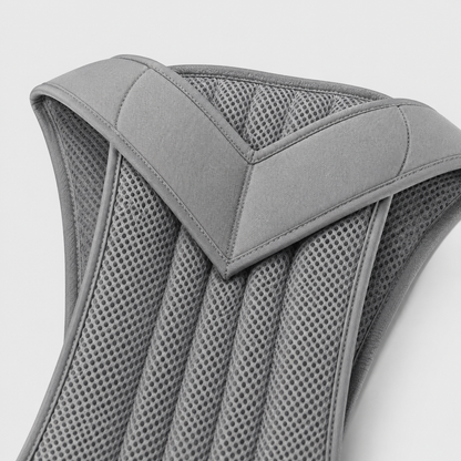Close-up of the grey brace's padded V-shaped shoulder section and the ribbed breathable mesh panels with stitched edging. 11