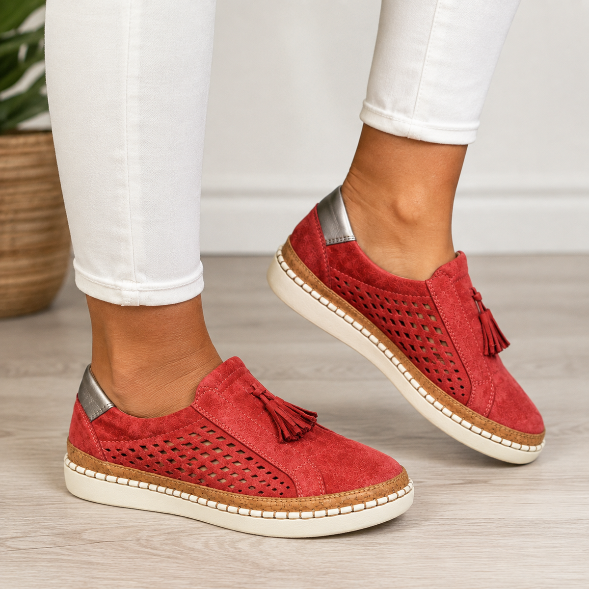 Red suede slip-on loafers with tassels and diamond cut-outs, worn with white skinny jeans 1