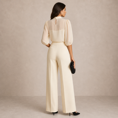 Back view of the cream set on a model, with keyhole neck and rear trouser pockets 5