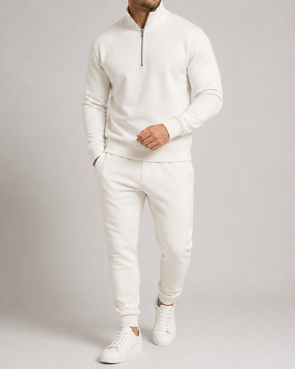 Model wearing the off-white tracksuit with white trainers, showing the half zip and ribbed cuffs 4