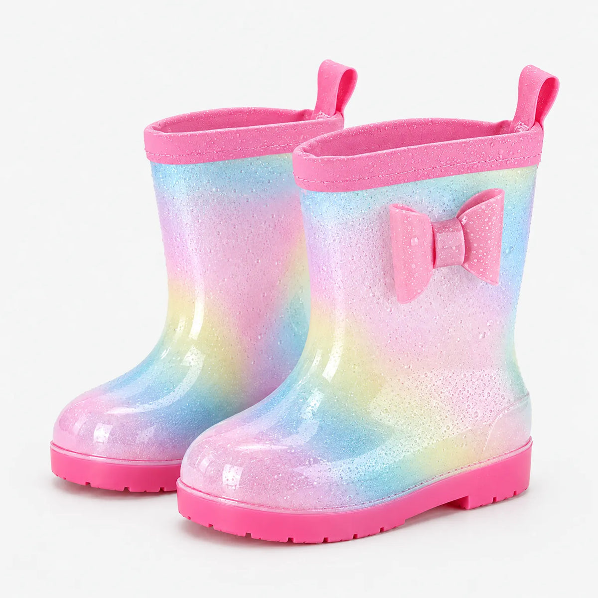 Pair of glittery pastel rainbow wellies with a pink bow, pink rim and pull tabs, dotted with water droplets. 7