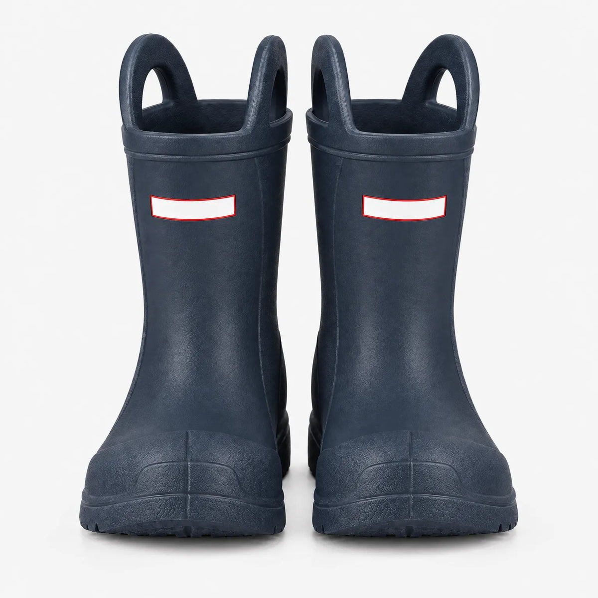 Front view of a pair of navy blue wellies showing the two top handles, blank white tabs and chunky toe caps. 4