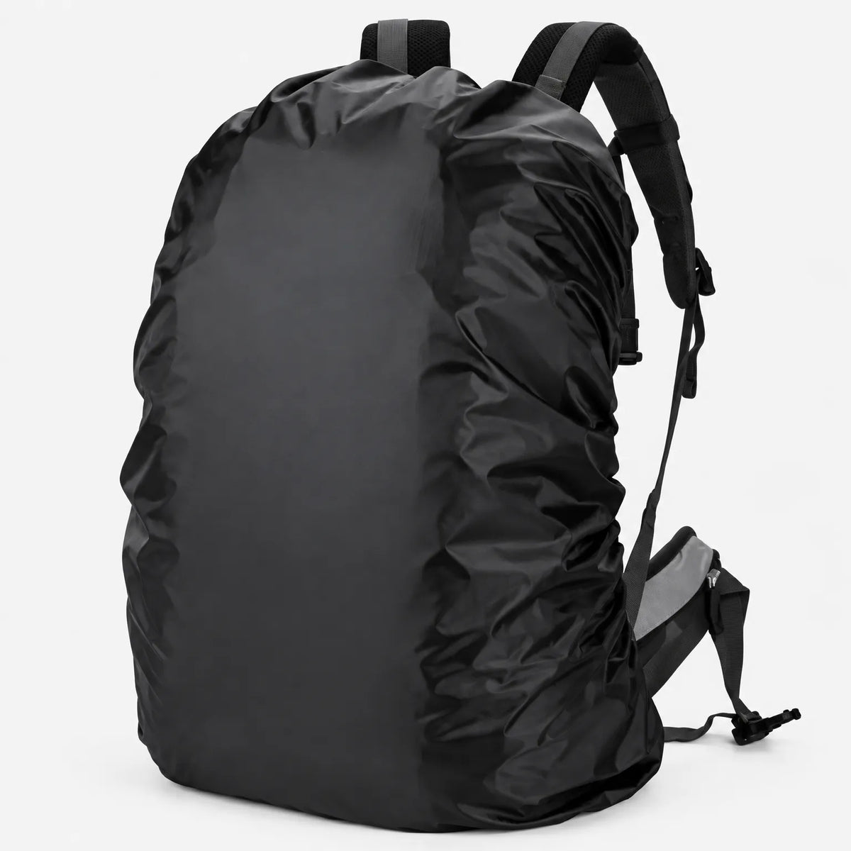 Black rucksack cover stretched snugly over a backpack on a plain white background, shown from the side with the shoulder straps visible. 2