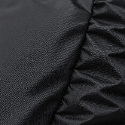Close-up of the black cover's fabric, showing its fine woven texture and a gathered, elasticated fold at the edge. 5