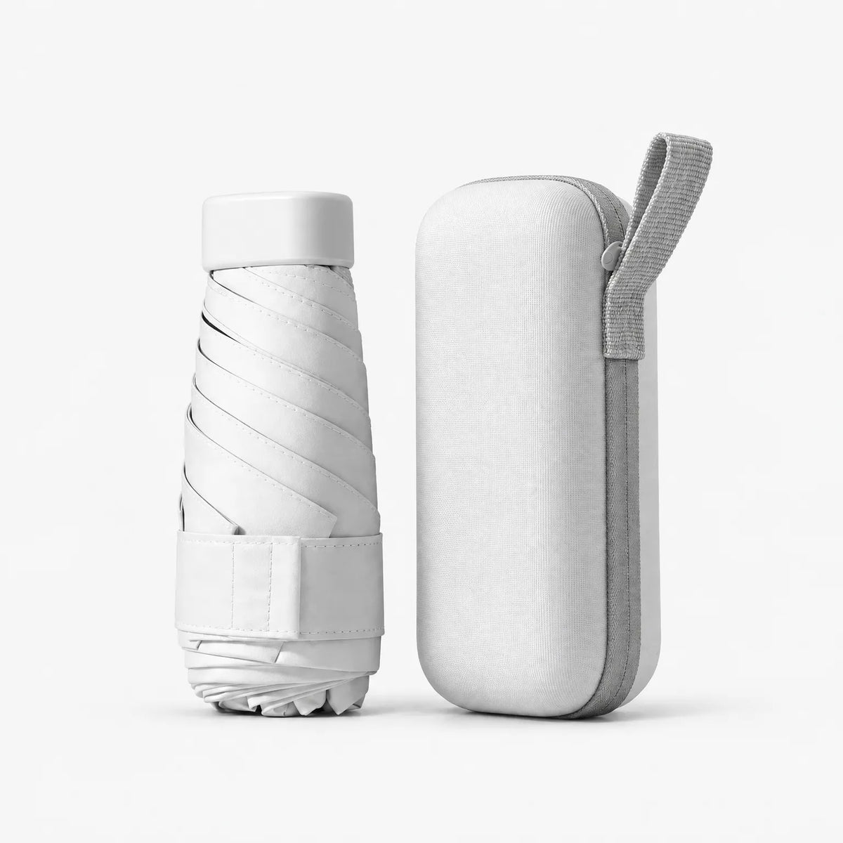 Folded white umbrella with a Velcro strap beside its matching white hard case with a grey zip and carry loop. 10