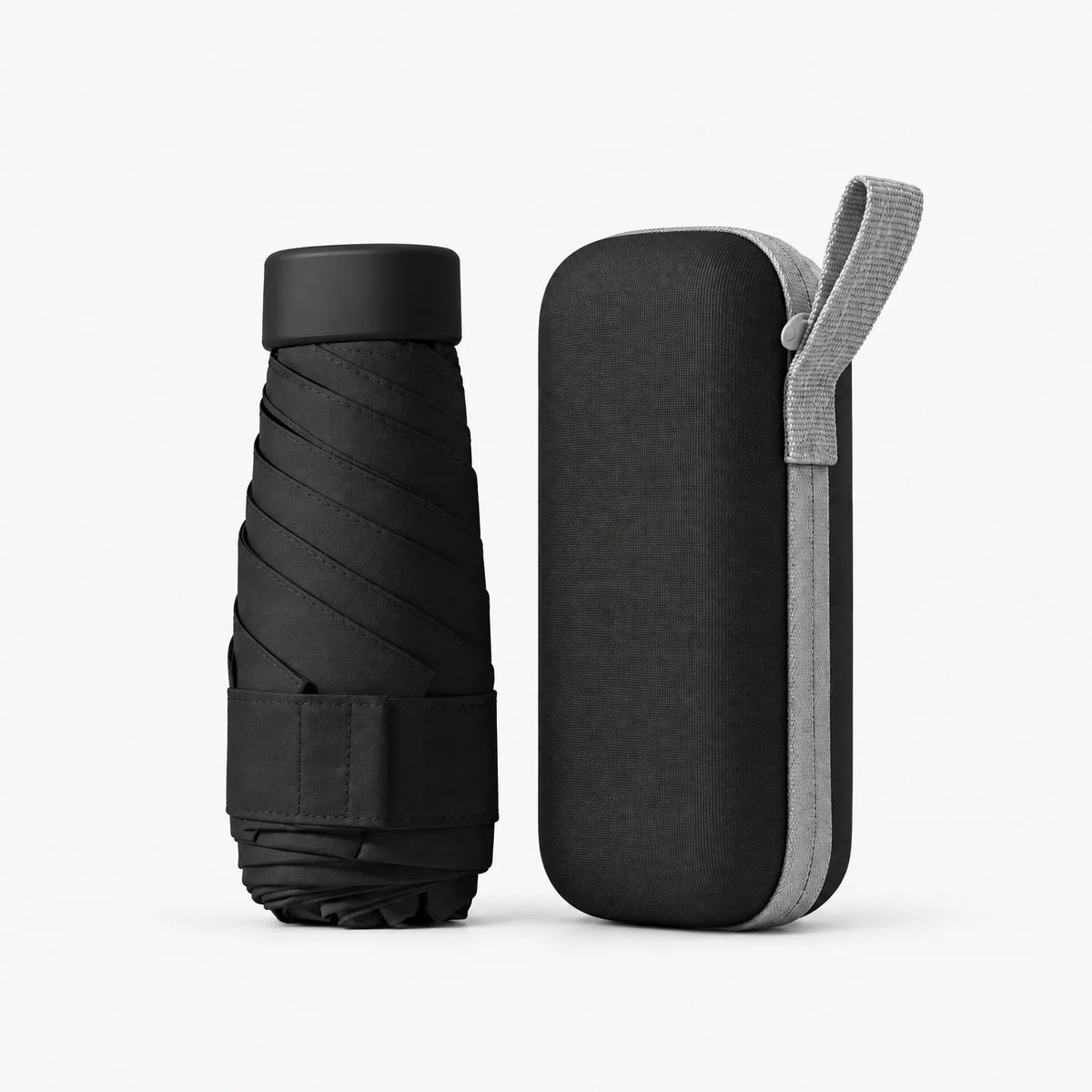 Folded black umbrella with a Velcro strap beside its matching black hard case with a light grey zip and carry loop. 12