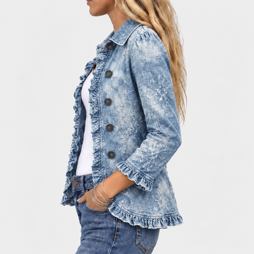 Side view of the denim jacket showing the ruffled front edge, ruffled cuff and hem, and faint floral print on the sleeve 3