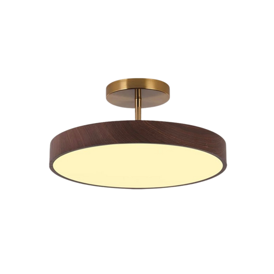 Dark wood-effect round semi-flush light with a brass-coloured stem and canopy, lit and shown against a plain white background. 2