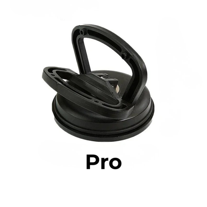 Black plastic suction puller in the larger size, with a folding handle and rubber rim, on a white background. 10