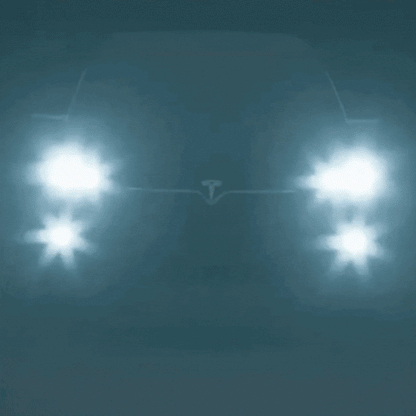 Blurry car headlights glowing in thick night fog, with a bluish tint and starburst glare around each lamp. 6