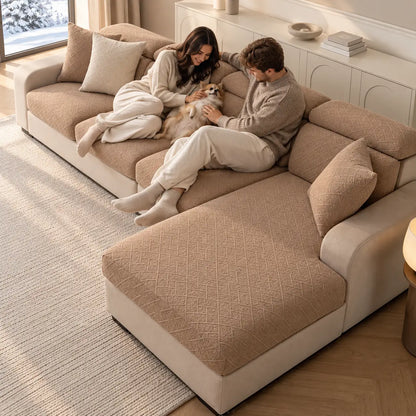Couple relaxing with a small dog on a tan covered corner sofa, seen from above 16