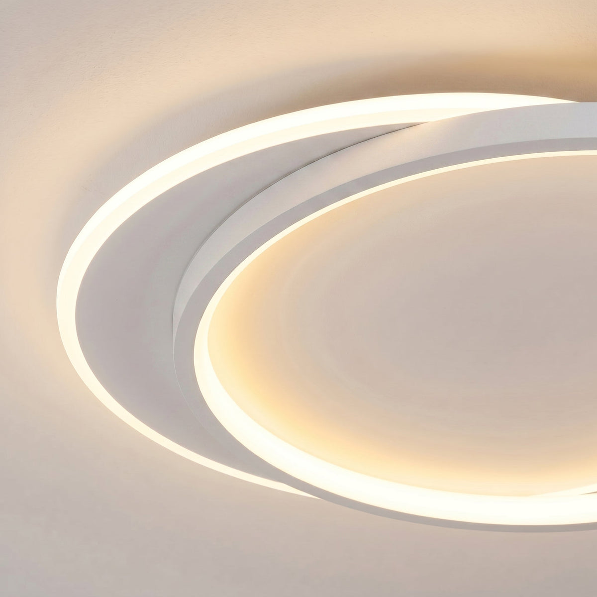 Close-up of the overlapping white rings, showing the soft glowing edges and slim profile 2
