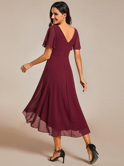 Back view of the burgundy dress showing the deep V back, centre zip and uneven high-low hem. 4