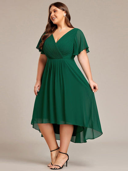 Side view of the dark green dress on a plus-size model, showing the pleated waist and high-low chiffon hem. 39