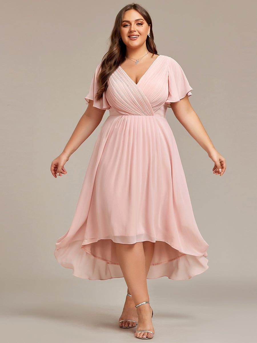 Front view of the pink dress on a plus-size model with arms out, showing the airy high-low chiffon skirt. 35