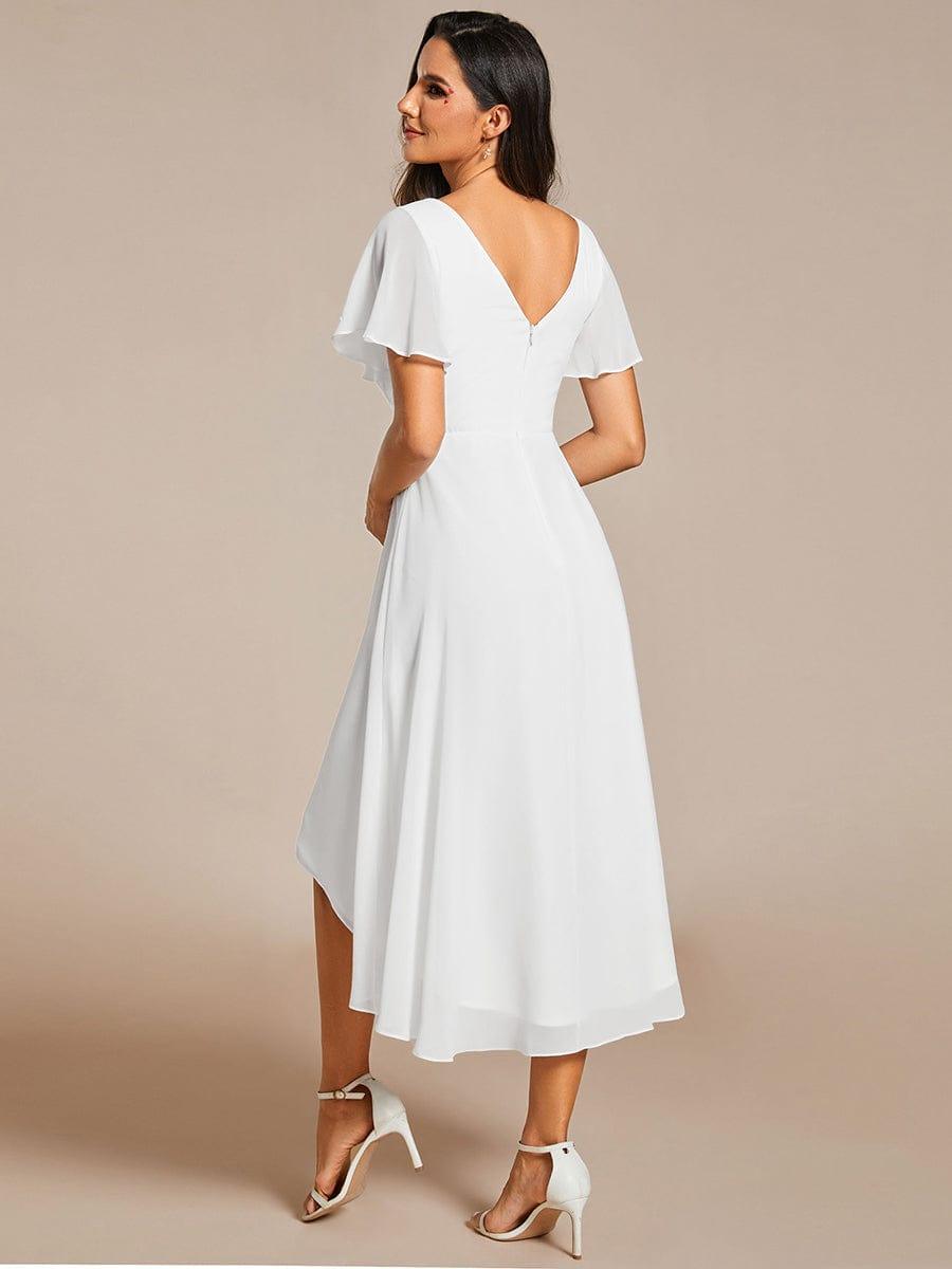 Back view of the white dress, showing the low V-back with zip and the high-low chiffon hem. 69