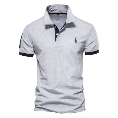 Light grey marl short-sleeved polo with navy cuffs, placket trim and a navy sleeve patch 4