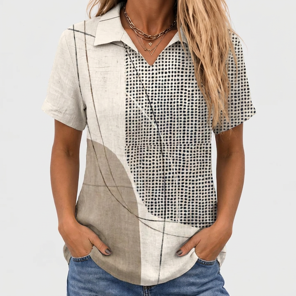 Close-up of the short-sleeved shirt worn with jeans, hands in pockets, layered gold necklaces, cropped at the face 1