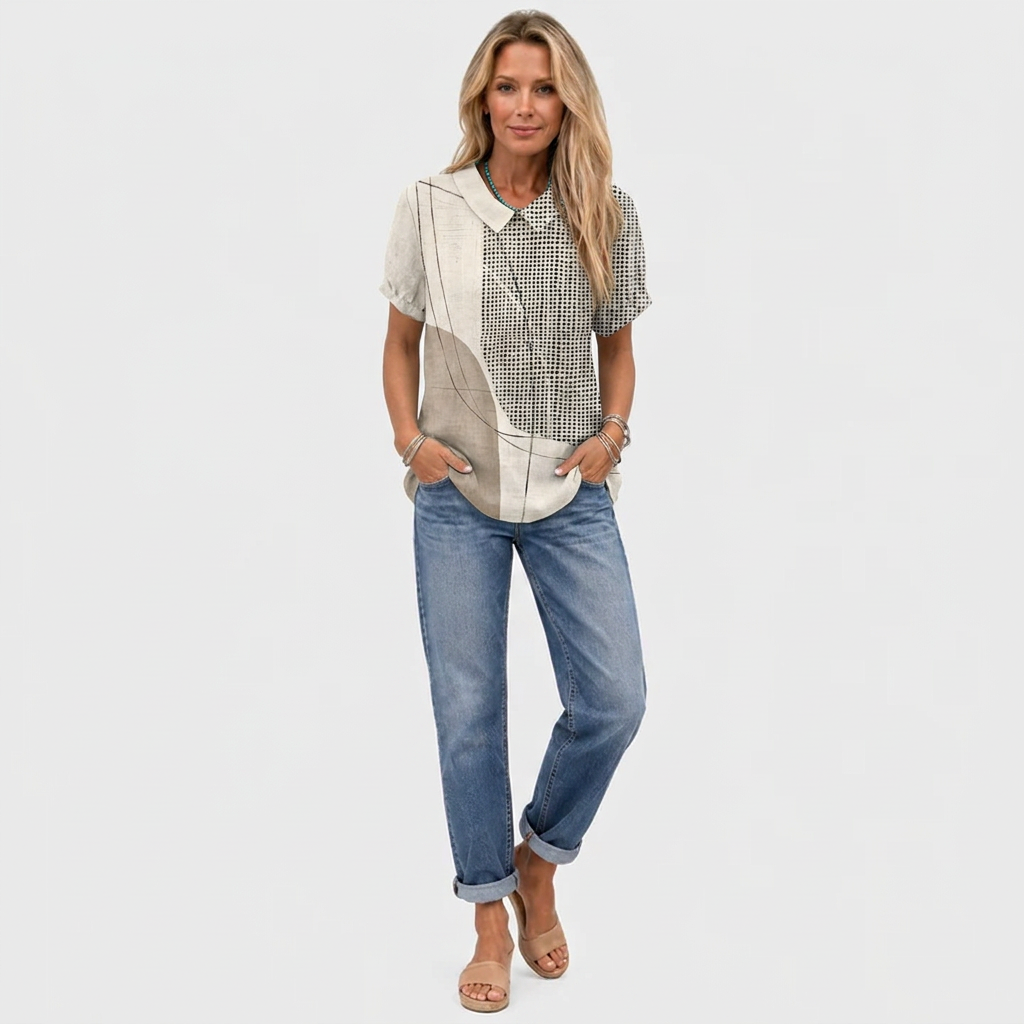 Full-length view of the shirt styled with rolled-up blue jeans and tan slip-on sandals 3