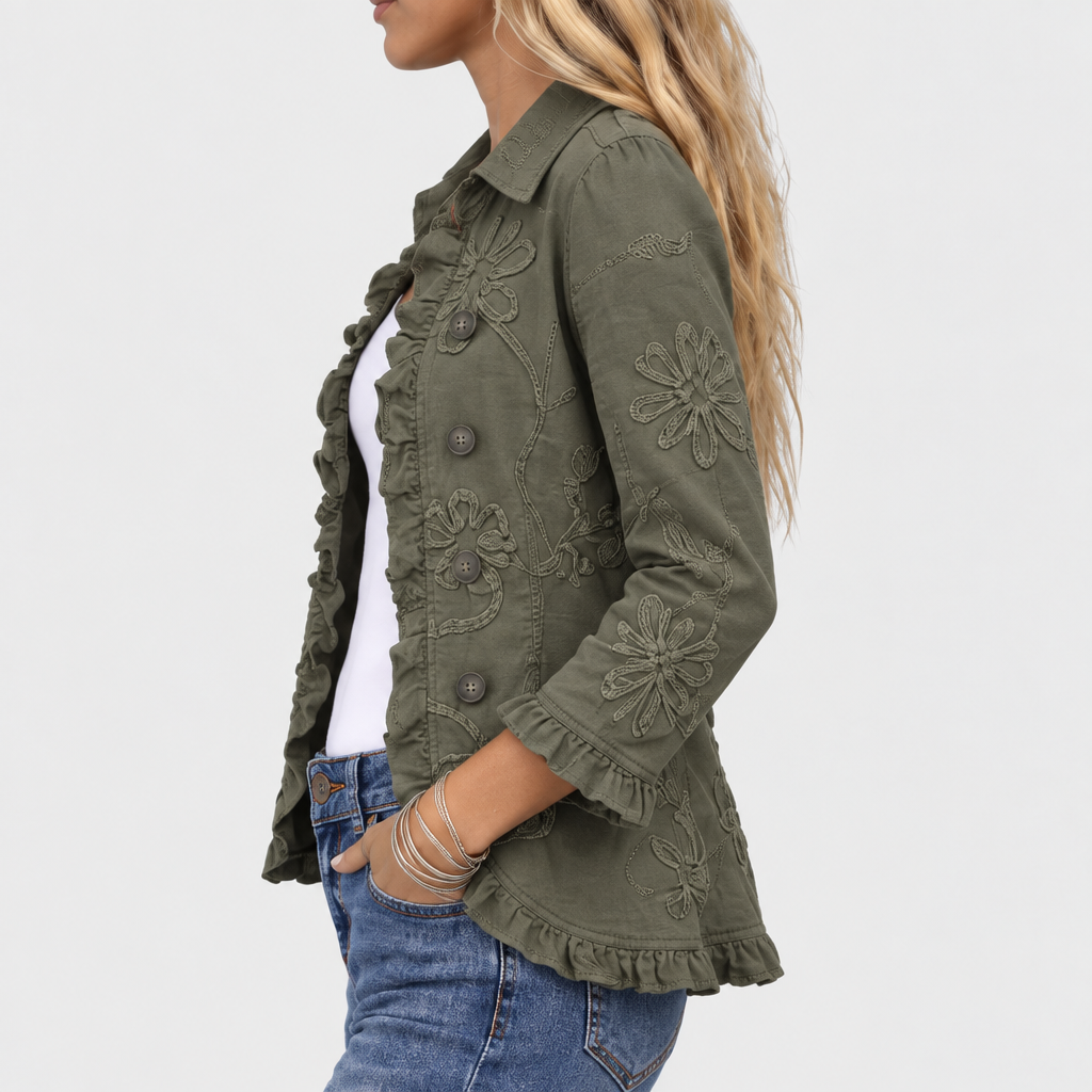 Side view of the jacket showing floral embroidery on the sleeve, ruffled cuff and ruffled hem. 4
