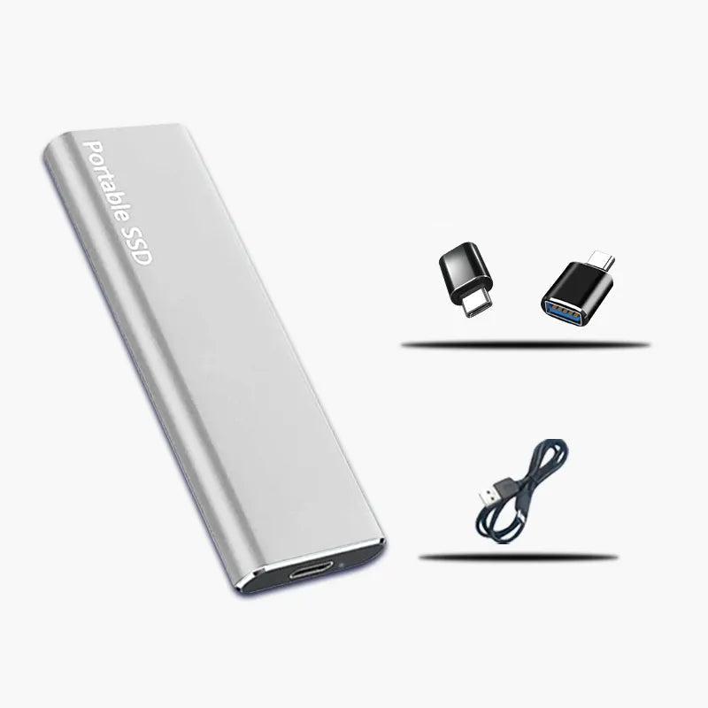 Silver version of the slim drive beside two small black USB adapters and a coiled black connecting cable. 2