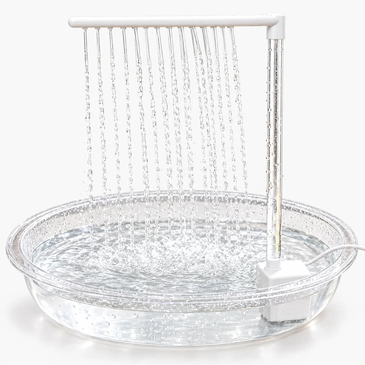 Clear shallow basin with a white pump and a horizontal spray bar releasing many fine streams of water, shown on a plain white background. 1