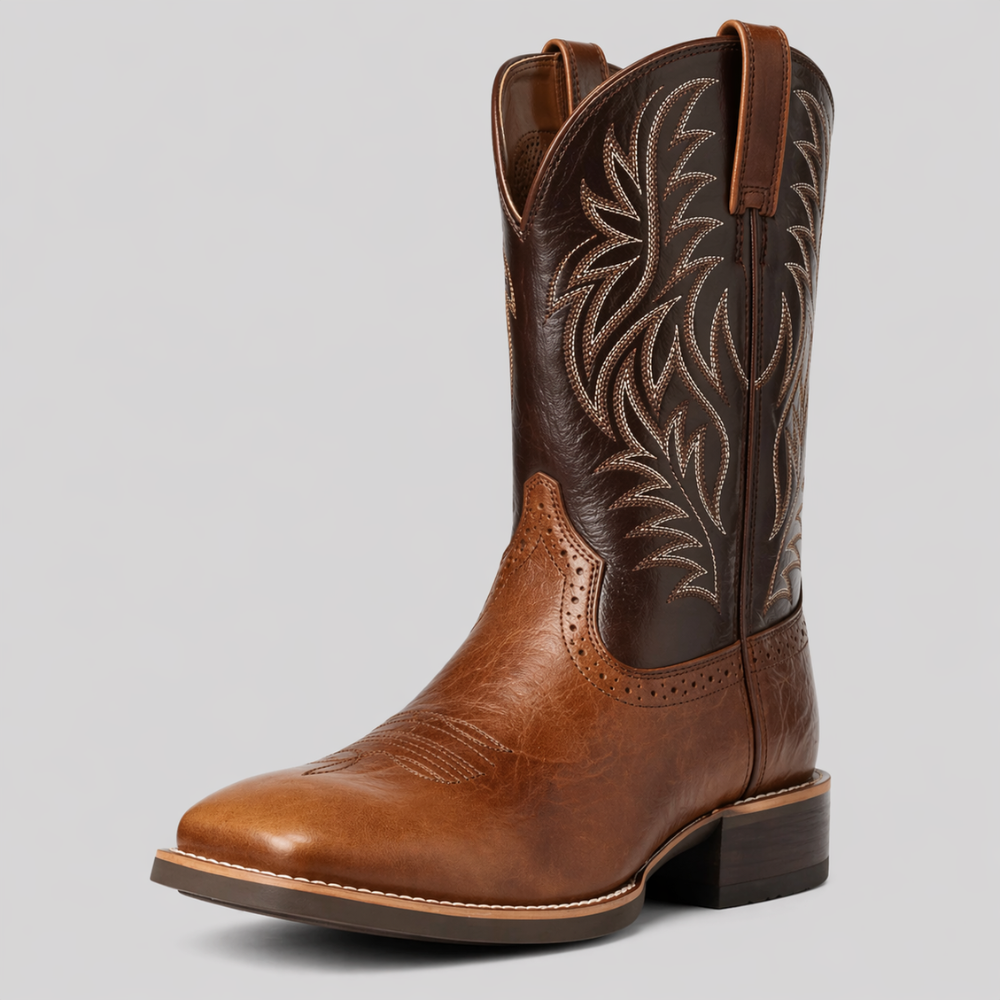 Tan and dark brown cowboy boot angled from the front, showing cream stitching on the shaft and a stacked heel 2