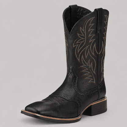 Black leather cowboy boot seen from the front at an angle, with white and brown stitched shaft patterns 1