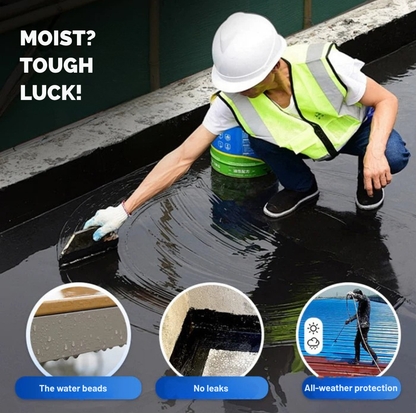 Worker in hard hat and hi-vis vest spreading dark coating on a flat roof 3