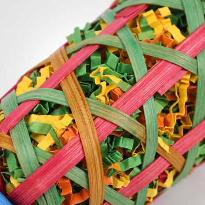 Close-up of the woven bamboo strips in pink, green and orange, with colourful shredded paper packed inside. 4