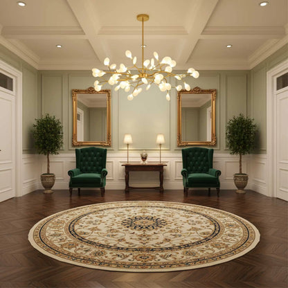 Gold version of the chandelier hanging in a formal hallway with green armchairs and gold mirrors 4