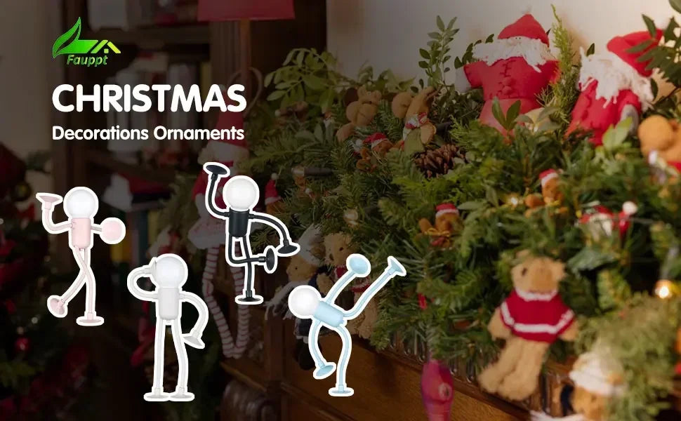 Four figure lights in pink, white, black and blue shown against a Christmas garland and soft toys 19